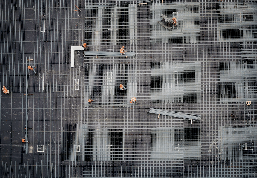 roof contractors working on metal commercial roof