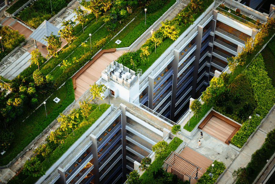 apartment building with green space on roof