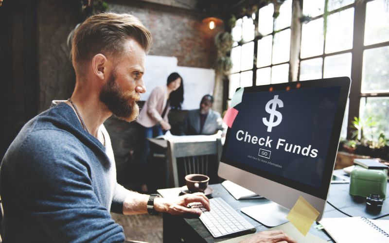 man and check funds finance concept